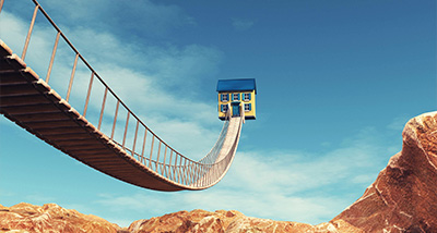 suspension bridge leading to a whimsical house in the sky surrounded by rocky terrain and blue sky three unique architectural designs